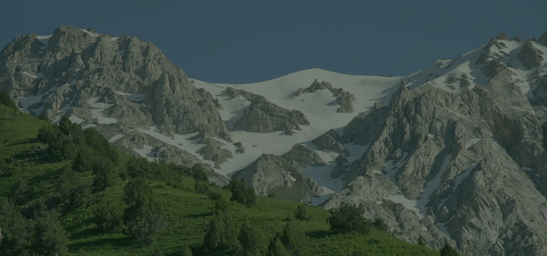 Beautiful mountainous landscape of Tajikistan with snow-capped peaks and green valleys